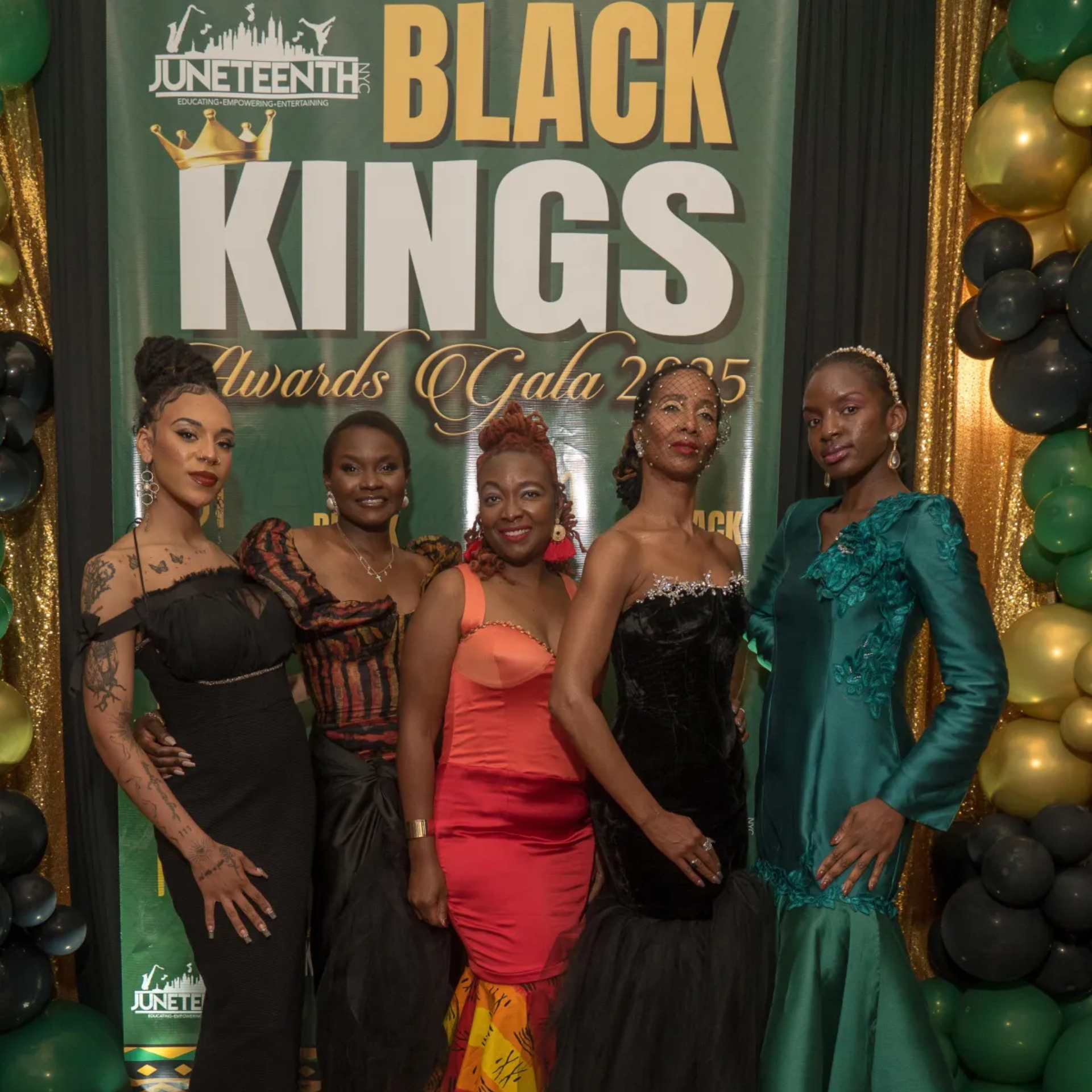 Group photo at Juneteenth NYC Black Kings Awards Gala 2025 with formal attire and festive backdrop
