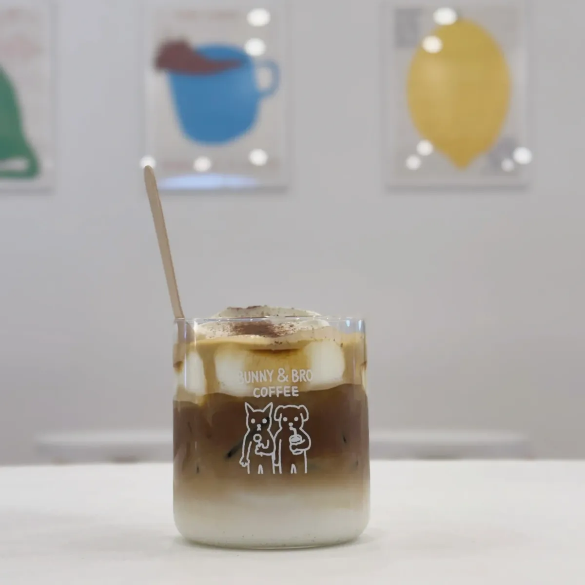 Glass of iced coffee with bunny and bear illustration