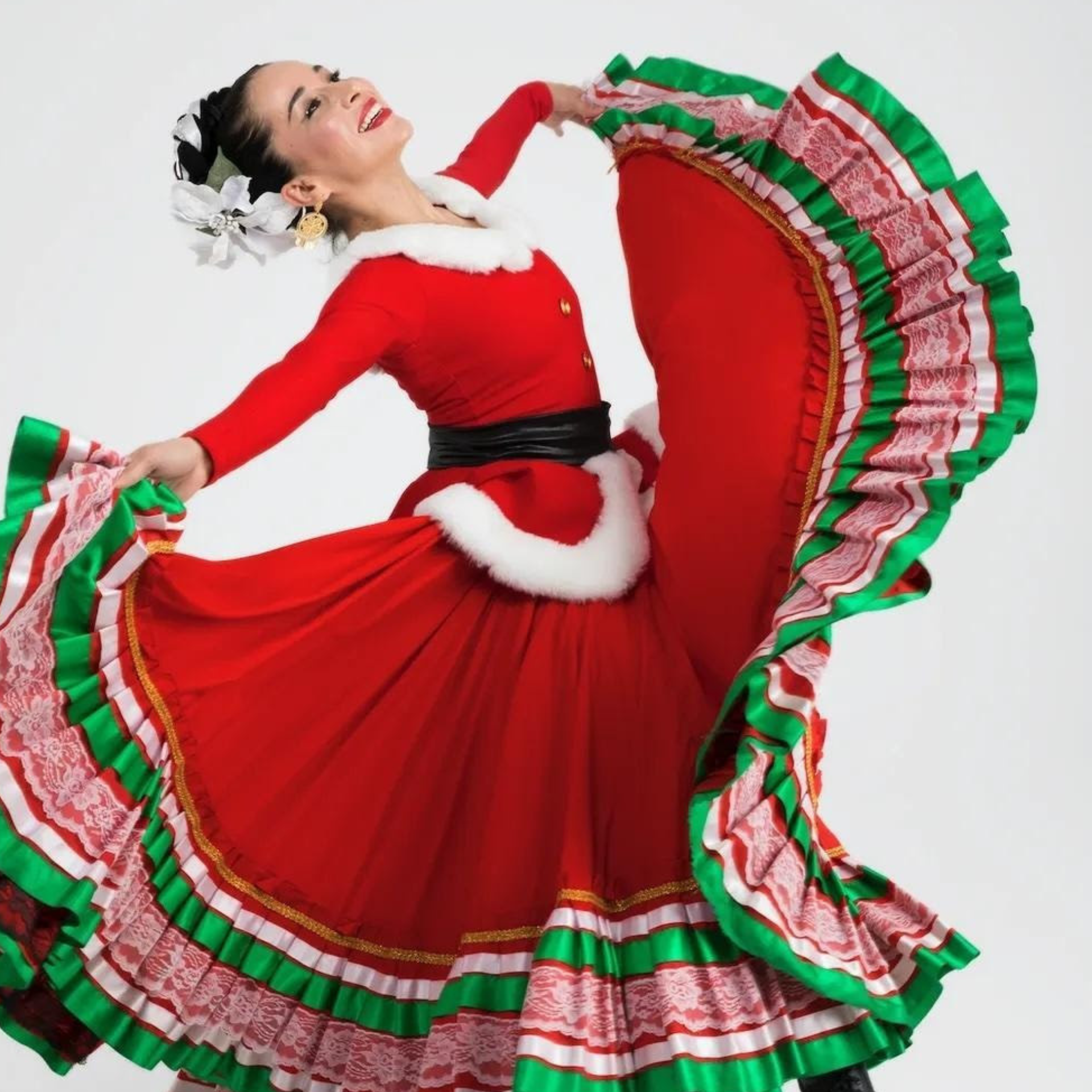 Dancer in a red folkloric dress with holiday accents, twirling mid-motion with a joyful expression