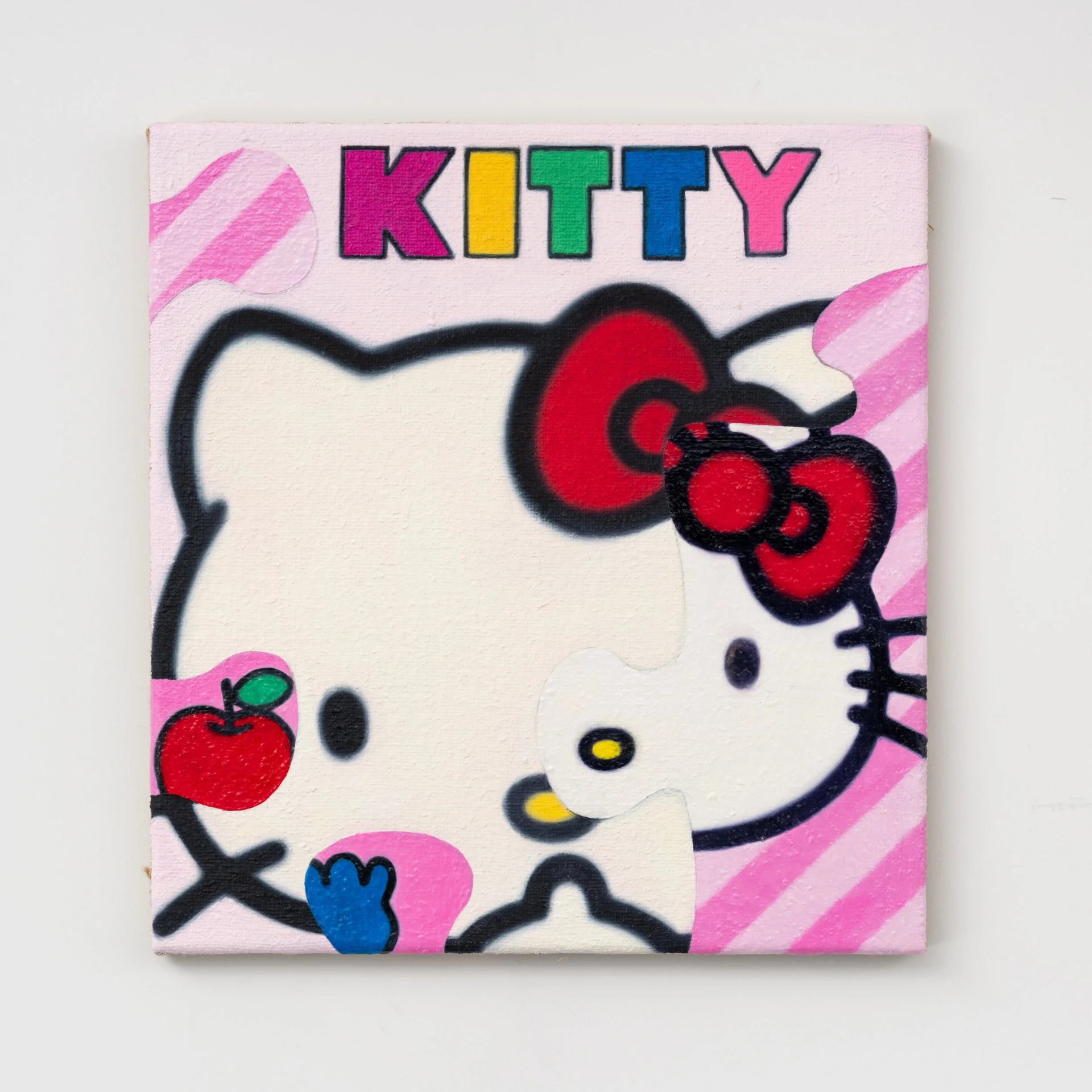 Colorful Hello Kitty puzzle artwork with pink striped background, bold KITTY letters, red bow, and missing piece