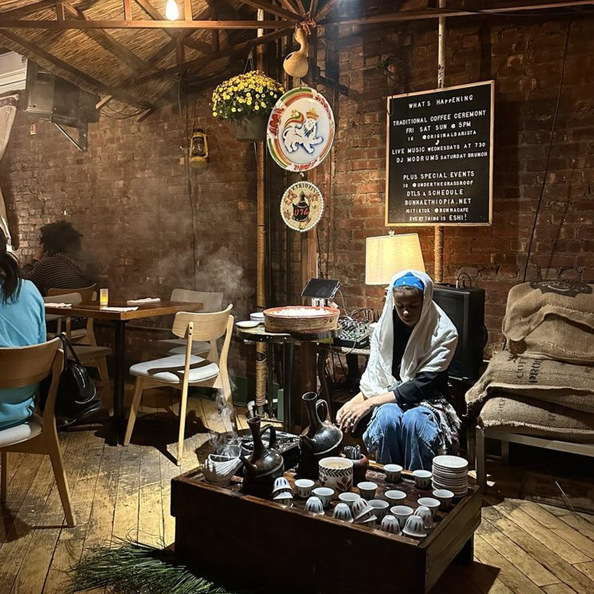 Indoor café with rustic décor and traditional Ethiopian coffee ceremony setup