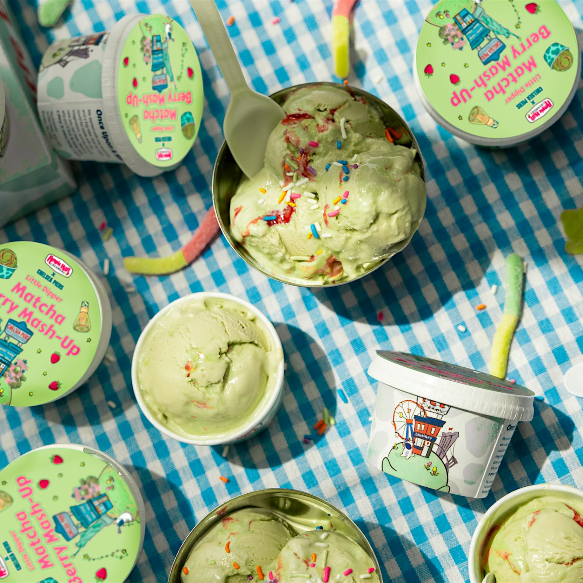Matcha Berry Mash‑Up ice cream containers and bowls with sprinkles on checkered cloth, playful summer treat featured in daily things to do in NYC any day