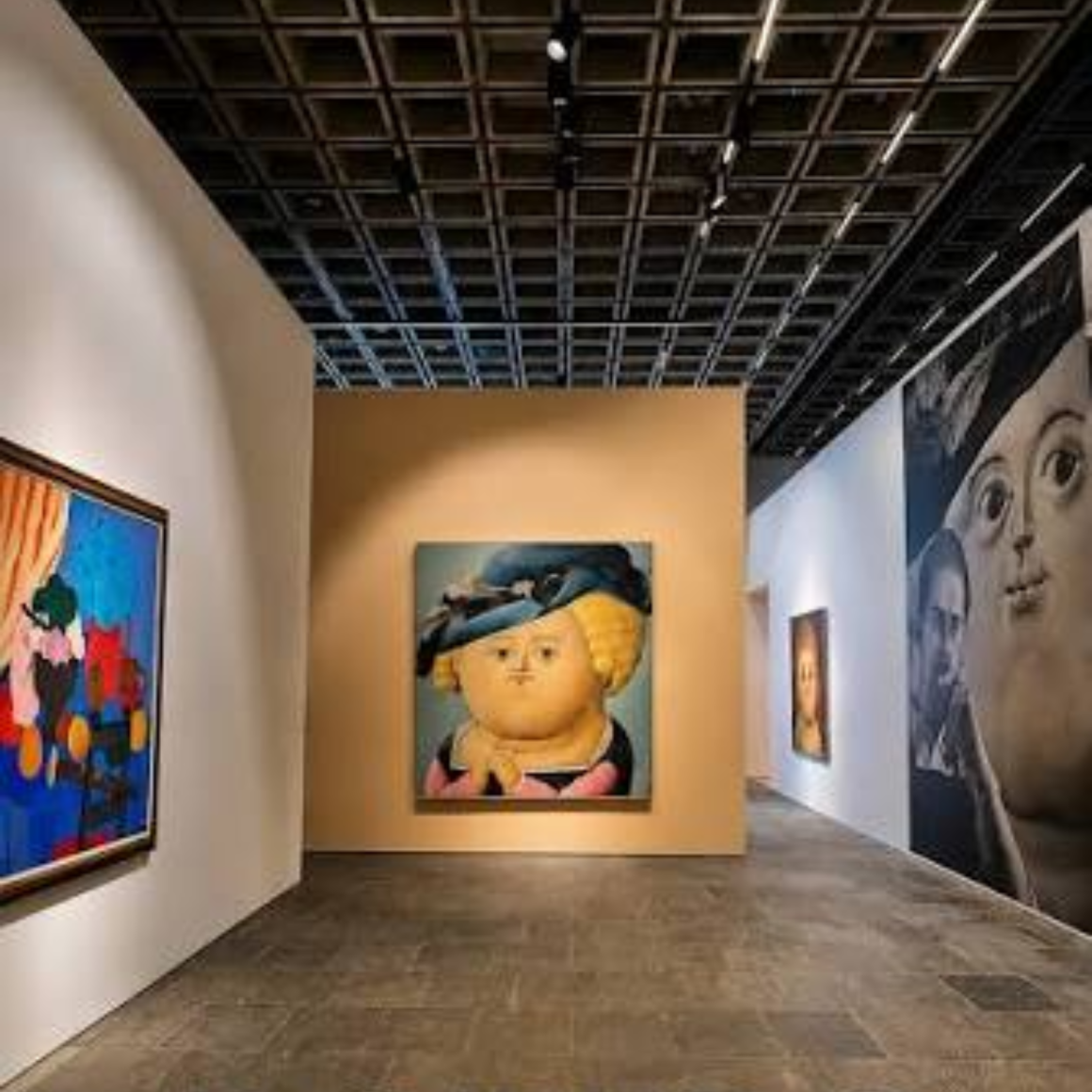 NYC Labor Day art gallery exhibition featuring Fernando Botero portrait with round details, colorful abstract works, and modern gallery design, cultural visit featured in daily things to do in NYC any day