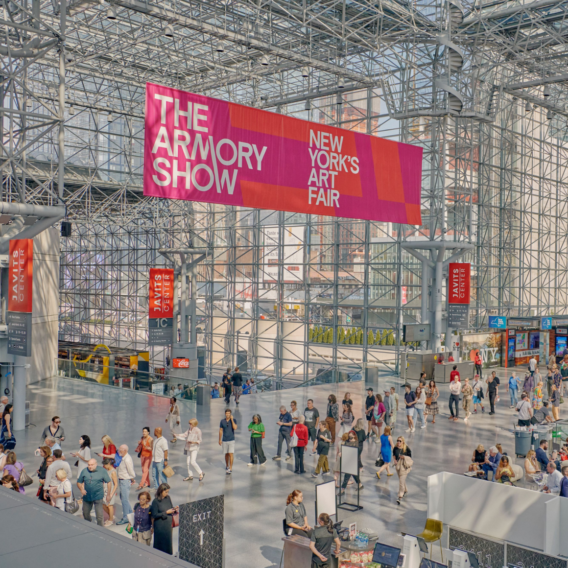 NYC Labor Day art fair at Javits Center with banner for The Armory Show, glass and steel hall filled with people, cultural exhibition featured in daily things to do in NYC any day
